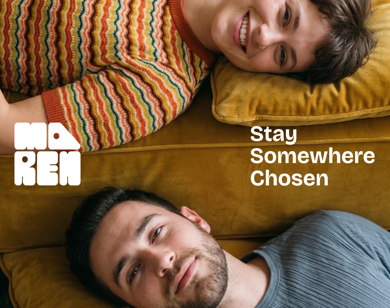 Two people lying head-to-head on a mustard sofa for the Maren brand campaign